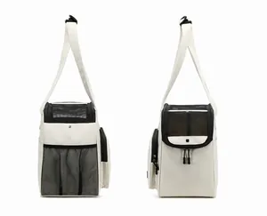 Front and side views of a cream canvas pet carrier bag with black mesh windows and strap