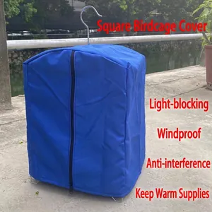 Close-up of a blue square bird cage cover with a zipper for lightproof and windproof use.