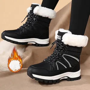 Schwarze Damen-Schneestiefel mit dickem weißem Kunstfellfutter und Schnürung, wasserfest