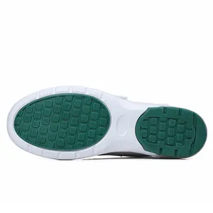 Professional white rocker sole nurse shoes with green anti-slip grip pattern