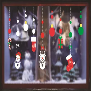 Vista detallada de coloridas pegatinas navideñas con muñeco de nieve y reno.