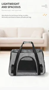 Front view of a grey portable pet carrier bag featuring breathable mesh and durable handles