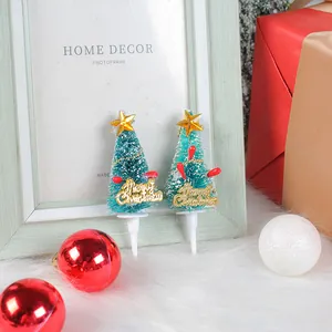 Mini teal Christmas tree cake toppers with gold star and Merry Christmas sign for holiday