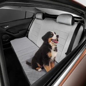 Grey waterproof pet car seat cover installed on the back seat featuring a puppy dog