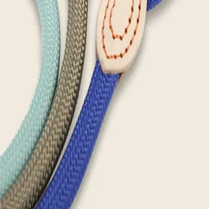 Close-up of durable braided nylon dog leashes with reinforced leather stitching
