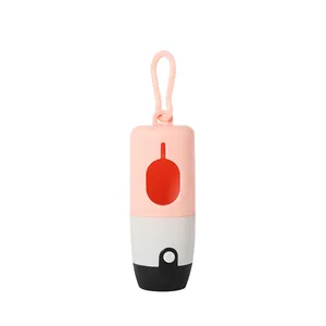 Detail view of pink portable dog poop bag dispenser with LED light and hanging hook