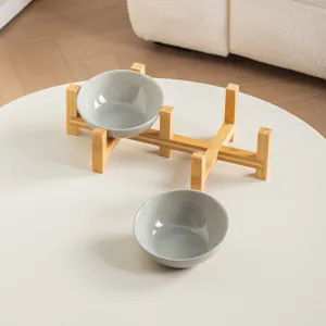 Modern gray ceramic pet bowl set with an elevated bamboo stand for cat and dog neck protection
