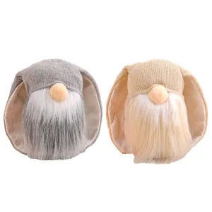 Two adorable Easter bunny gnomes with long ears and fuzzy beards for party decor
