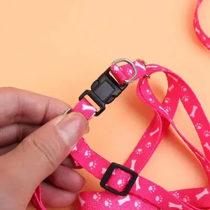 Durable pink pet leash and harness with bone and paw print patterns for cats and dogs.