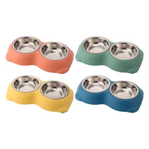 Set of four double stainless steel pet bowls with colorful non-slip bases for cats and dogs