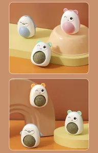 Collection of cute animal-shaped rotating catnip balls on colorful geometric stands