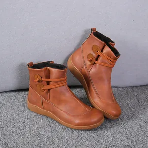 Stylish brown faux leather women's Martin boots with side button details and fur lining