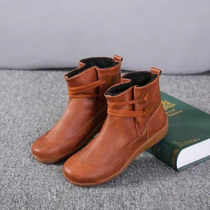 Brown British style workwear ankle boots with warm fleece lining and decorative strap detail