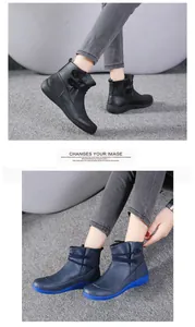 Detailed view of British style women's work Martin boots in black and blue colors