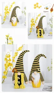 Detailed view of cute Bee Festival gnome plush dolls with yellow and black stripes deco