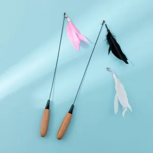 Interactive cat teaser wand featuring a natural wooden handle and fluffy feathers