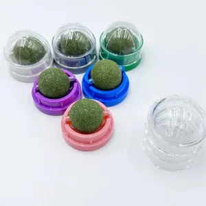 Rotating catnip balls for cats with colorful bases and protective clear covers