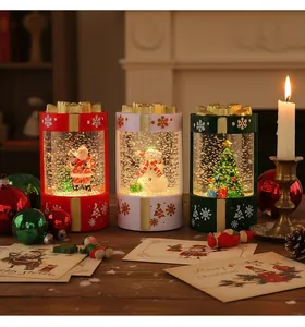 Festive gift box shaped Christmas water lanterns with Santa, Snowman and Tree details