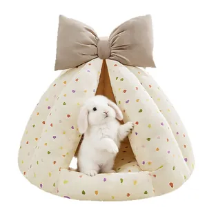 Semi-enclosed rabbit bed with colorful heart pattern and large bow decoration