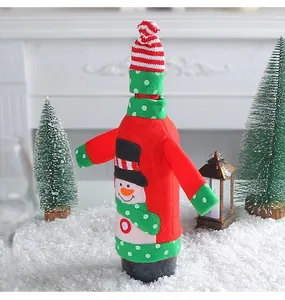Detail showing a festive red felt wine bottle cover with a cute snowman appliqué