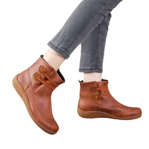 Classic British style brown leather ankle boots for women featuring stylish button detail