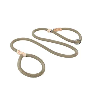 Detail view of the durable khaki braided P-rope dog leash with leather reinforcement