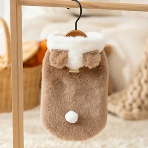 Close-up of a warm brown plush pet vest with cute bear ears and a metal D-ring for leashes