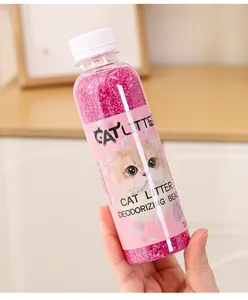 Detailed close-up view of pink cat litter deodorizing beads inside a clear bottle for pet fresh air