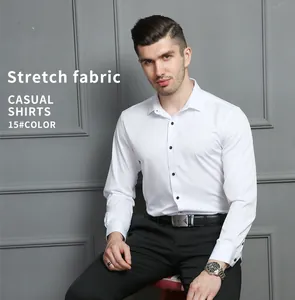 Close-up view of a men's white long-sleeved stretch business shirt with black buttons.