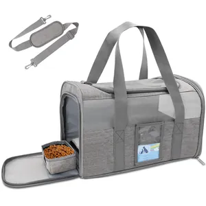 Close-up detail of foldable grey pet carrier with shoulder strap and collapsible bowl