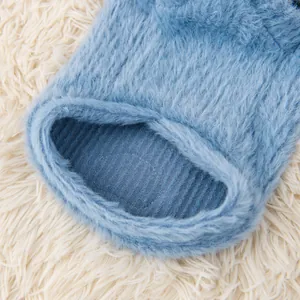 Close-up detail of blue fuzzy fleece pet hoodie showing thick soft fabric texture