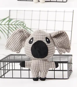 Detail of a cute gray corduroy koala plush dog toy with a squeaker for dental health.