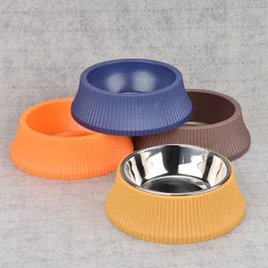 Detailed view of colorful anti-tip pet bowls with removable stainless steel liners.