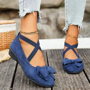 Elegant blue suede wedge flats with bow detail and cross elastic ankle straps for women