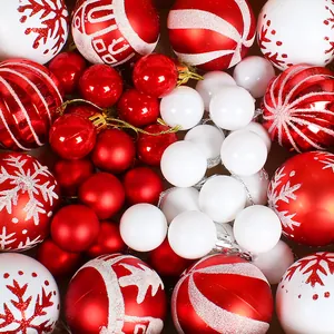 Festive red and white Christmas baubles set featuring painted snowflake patterns