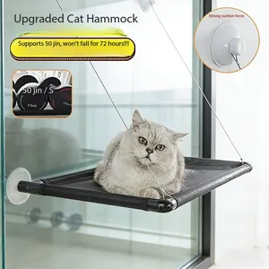 Close-up of black mesh window cat hammock with strong suction cups and a gray cat