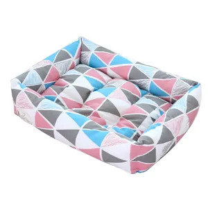 Comfortable rectangular dog bed featuring a colorful geometric triangle pattern for pets.