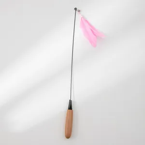 Full view of feather cat teaser wand with natural wooden handle and pink feathers