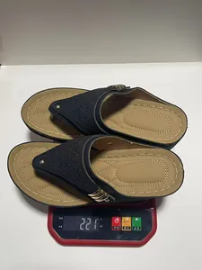 Women's laser-cut navy platform flip-flop slippers shown on a scale weighing 221g