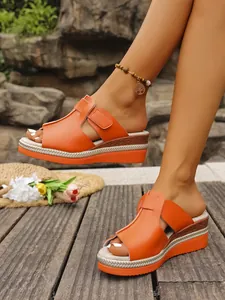 Orange wedge sandals for women with hollow-out peep toe and platform braided sole detail