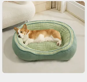 Close-up of a soft textured green pet bed featuring a cozy Corgi resting comfortably.