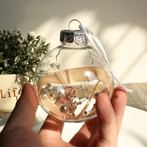 Bola de Navidad transparente con cinta dorada y cuentas para decorar el árbol