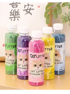 Close-up detail of five colorful bottles containing scented cat litter deodorizing beads