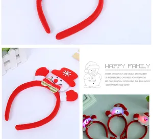 Detailed view of red Christmas headbands with luminous snowman and Santa Claus designs
