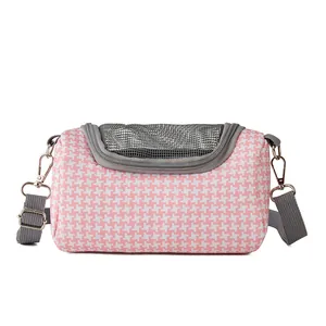 Detail view of pink houndstooth small pet carrier bag with breathable grey mesh top