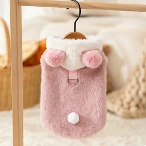 Detailed close-up of a pink plush pet vest featuring cute bear ears and a leash D-ring