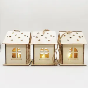 Set of 3 wooden Christmas house ornaments with warm LED lights and star cutout roof