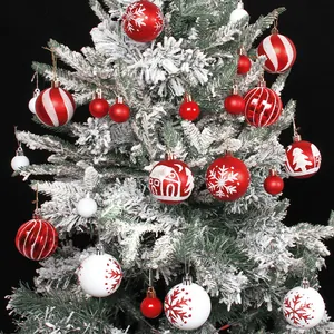 Festive red and white Christmas ball ornaments featuring snowflake and house patterns