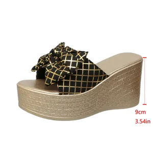 Side view of wedge sandal with bow detail and 9cm heel height measurement
