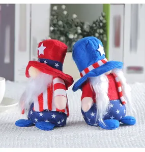 Pair of patriotic 4th of July gnomes with American flag patterns on white table